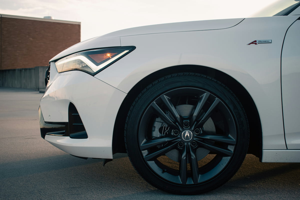 Acura wheels and tires on a white Acura