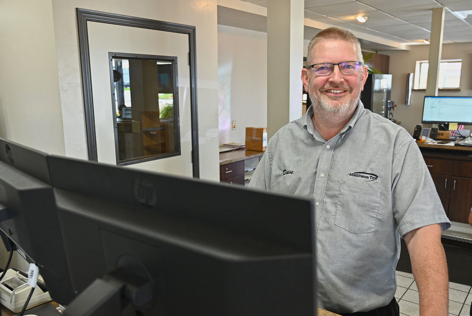 Matthews Tire Appleton West manager Dave Flunker at front desk