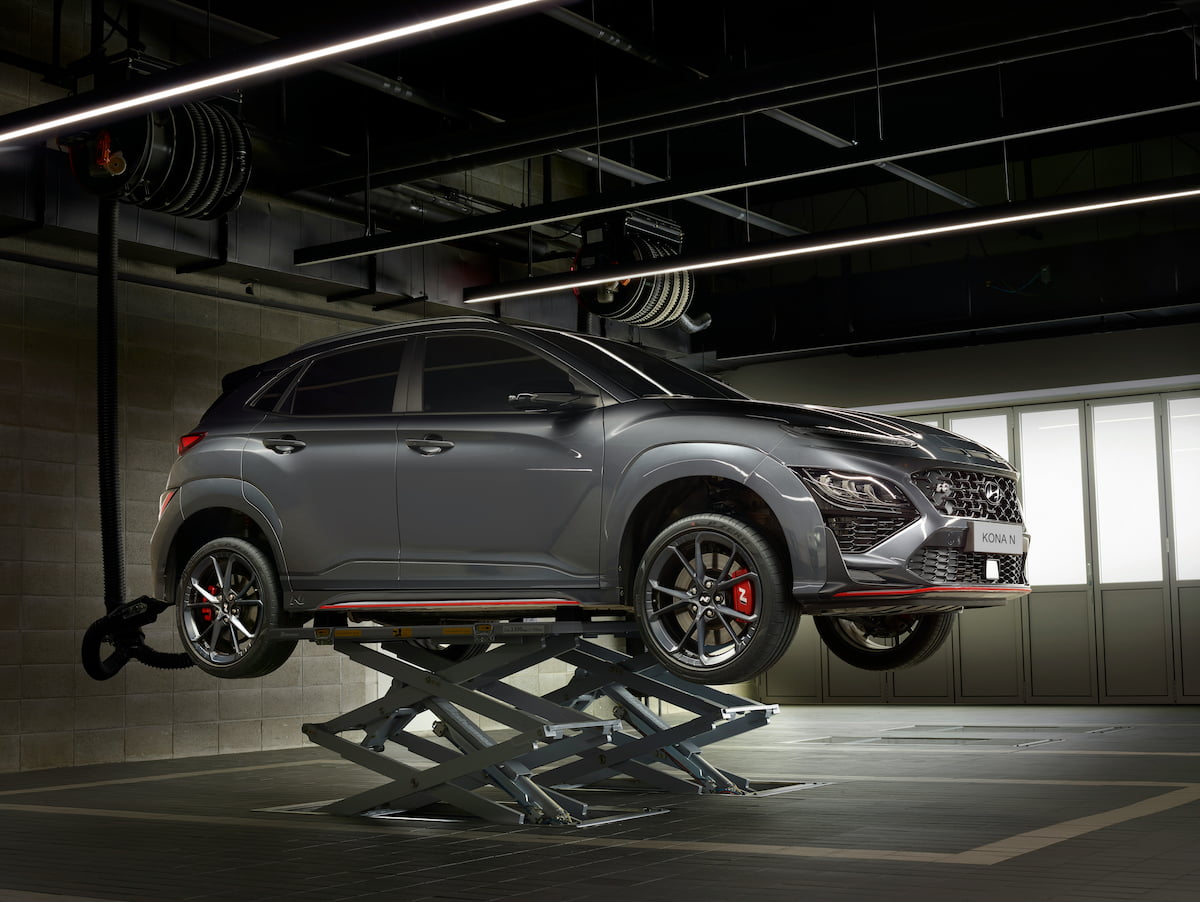 Hyundai SUV on lifts in shop for repairs