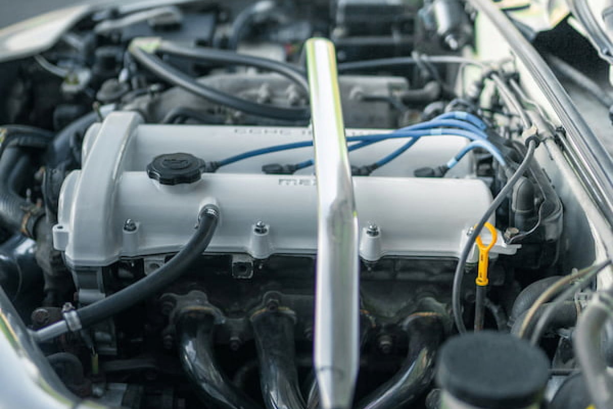 Oil being poured into engine during an oil change service