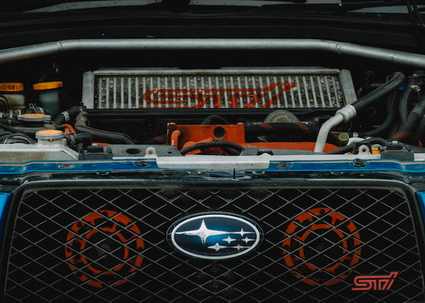 Oil being poured into engine during an oil change service