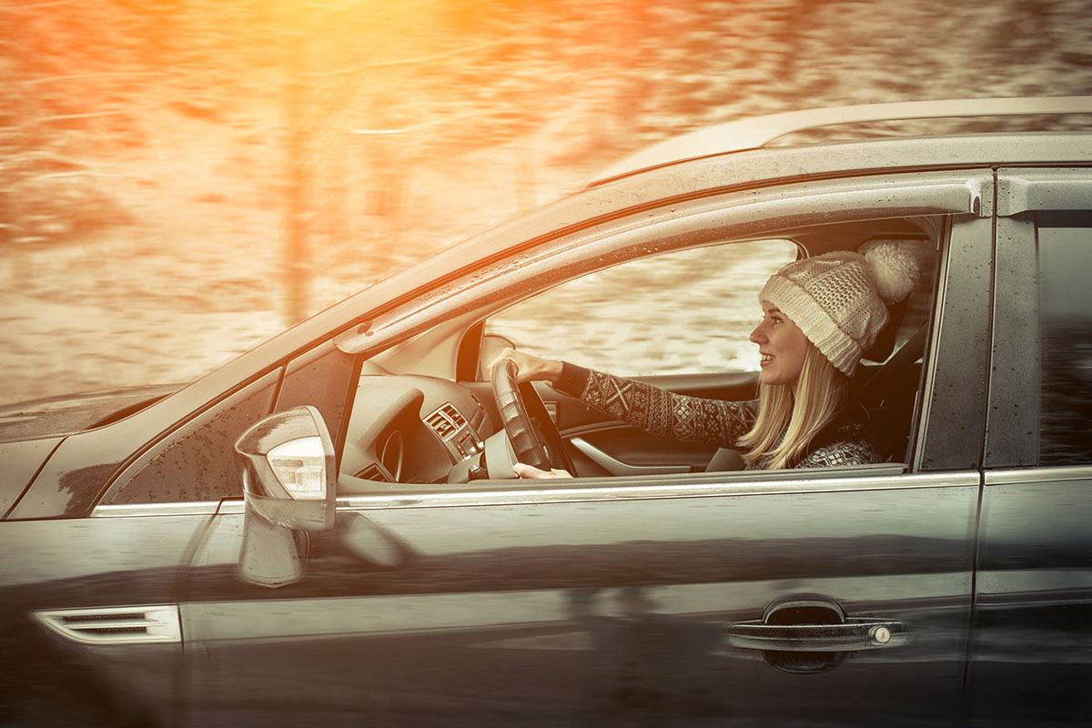 Happy family driving in a car together